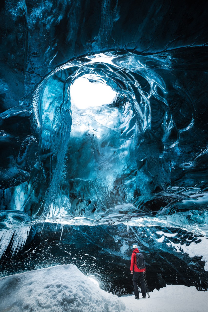 Hiking through the ice cave under Vatnajökull glacier in Iceland